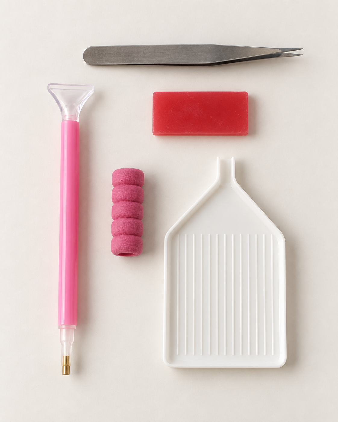 Rhinestone applicator pen, tweezers, wax pad, foam tip and stone tray included in every PhelaHaus kit